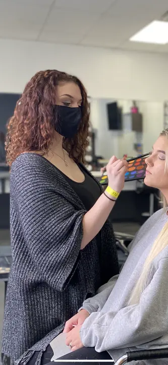 Blending eyeshadow on a client