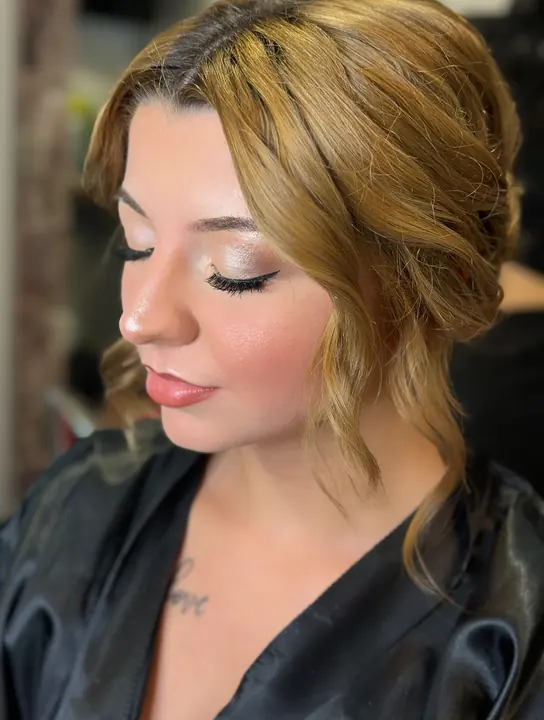 Soft glam with a warm shimmer eye and golden curls